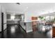 Spacious kitchen featuring stainless steel appliances and an open dining area at 627 N Cherokee Ave, Deland, FL 32724