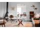 Cozy living room with fireplace and stylish mid century modern furniture at 627 N Cherokee Ave, Deland, FL 32724