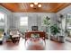 Bright and sunny office space with terracotta tile floors and wood paneled ceiling at 627 N Cherokee Ave, Deland, FL 32724
