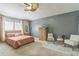 Spacious primary bedroom with large bed, stylish furniture, and neutral decor for a relaxing retreat at 636 Milan Dr, Kissimmee, FL 34758