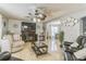 Inviting living room features fireplace, ceiling fan, and plenty of comfortable seating at 636 Milan Dr, Kissimmee, FL 34758