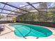 Beautiful screened-in pool with ample deck space, perfect for entertaining friends and Gathering at 636 Milan Dr, Kissimmee, FL 34758