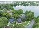 Lakefront homes with mature trees offer beautiful scenery near a body of water from a top-down perspective at 640 S Lake Formosa Dr, Orlando, FL 32803