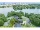 Aerial view showing the home's location on the water with a scenic view of the city skyline at 640 S Lake Formosa Dr, Orlando, FL 32803