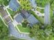 An aerial view reveals a home with pristine landscaping, manicured lawns, and beautiful yard in this neighborhood at 640 S Lake Formosa Dr, Orlando, FL 32803