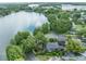 Beautiful aerial view of the property highlighting the lush landscaping and surrounding lake at 640 S Lake Formosa Dr, Orlando, FL 32803