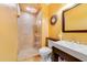 Bathroom with modern tile shower, a vanity sink, and a modern mirror at 640 S Lake Formosa Dr, Orlando, FL 32803