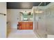 Large bathroom with double sink vanity, framed mirror and walk-in shower at 640 S Lake Formosa Dr, Orlando, FL 32803