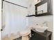 Well-lit bathroom with modern fixtures, including a vessel sink and a combination shower and tub at 640 S Lake Formosa Dr, Orlando, FL 32803