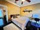 Comfortable bedroom with a queen-sized bed, minimalist decor, and a ceiling fan at 640 S Lake Formosa Dr, Orlando, FL 32803