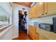 Hallway leading to walk-in closet featuring custom wood cabinets and storage space at 640 S Lake Formosa Dr, Orlando, FL 32803