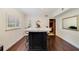 Stylish kitchen island with marble countertop and bar stools, offering a charming space at 640 S Lake Formosa Dr, Orlando, FL 32803