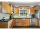 Charming kitchen with granite countertops, stainless appliances, and abundant cabinet space at 640 S Lake Formosa Dr, Orlando, FL 32803