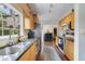Well-lit kitchen with stainless steel appliances, granite countertops, and wooden cabinets at 640 S Lake Formosa Dr, Orlando, FL 32803
