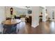 Open-concept living area featuring hardwood floors, a ceiling fan, and elegant furniture at 640 S Lake Formosa Dr, Orlando, FL 32803