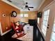 Cozy living room featuring a rocking chair, comfortable seating, and a stylish rug at 640 S Lake Formosa Dr, Orlando, FL 32803