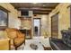Unique living space featuring stone walls, wood beams, wet bar and elegant seating at 640 S Lake Formosa Dr, Orlando, FL 32803