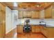Bright office featuring custom wood cabinets, hardwood floors, and a desk at 640 S Lake Formosa Dr, Orlando, FL 32803