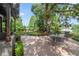 Outdoor patio with brick pavers, scenic landscaping, and partial water view of the adjacent lake at 640 S Lake Formosa Dr, Orlando, FL 32803