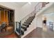 Entryway staircase features ornate iron railings and hardwood floors at 640 S Lake Formosa Dr, Orlando, FL 32803