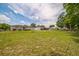 Expansive backyard with lush green grass, offering ample space for outdoor activities at 6401 Fortune Ln, Apopka, FL 32712