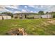 A spacious backyard with a patio, perfect for outdoor entertaining and relaxation at 6401 Fortune Ln, Apopka, FL 32712