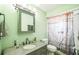 Bathroom featuring a mirror, sink, shower, and toilet at 6401 Fortune Ln, Apopka, FL 32712