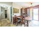 Dining room features classic wood furniture and a vintage-style light fixture at 6401 Fortune Ln, Apopka, FL 32712