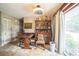 View of dining room with table, hutch and sliding glass door to backyard at 6401 Fortune Ln, Apopka, FL 32712