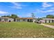 Charming one-story home with a well-maintained lawn and attached one-car garage at 6401 Fortune Ln, Apopka, FL 32712