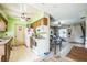 View of kitchen leading to living room and shows cabinetry and appliances at 6401 Fortune Ln, Apopka, FL 32712