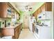 View of kitchen with appliances, sink, countertops, and doorway at 6401 Fortune Ln, Apopka, FL 32712