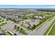 Aerial view of the community featuring pool, clubhouse, playground, and plentiful parking at 785 Orchid Grove Blvd, Davenport, FL 33837