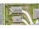 An overhead shot showing the rooftops of residential homes with driveways in a neighborhood, emphasizing the layout and architecture at 785 Orchid Grove Blvd, Davenport, FL 33837