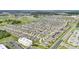 An extensive aerial photograph features a planned residential community with uniform houses and organized street layouts at 785 Orchid Grove Blvd, Davenport, FL 33837