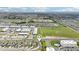 A panoramic aerial view showcases a community, highlighting the neighborhood layout, amenities, and nearby recreational areas at 785 Orchid Grove Blvd, Davenport, FL 33837