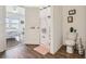 Bright bathroom featuring wood floors, a shower with a floral curtain, and a toilet at 785 Orchid Grove Blvd, Davenport, FL 33837