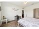 Bedroom with wood floors and gray cabinet at 785 Orchid Grove Blvd, Davenport, FL 33837
