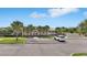 Community clubhouse featuring covered entry, bike racks, and nearby parking spaces at 785 Orchid Grove Blvd, Davenport, FL 33837