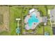Aerial view of a community pool with ample seating, surrounded by landscaping, offering a resort-like experience at 785 Orchid Grove Blvd, Davenport, FL 33837