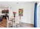 Cozy dining area with a round table, four chairs, and elegant decor near the kitchen at 785 Orchid Grove Blvd, Davenport, FL 33837