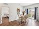 Charming dining area with a round table, chairs, and sliding door access to the backyard at 785 Orchid Grove Blvd, Davenport, FL 33837