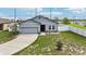Inviting single-Gathering home with well-kept lawn, attached garage, and neutral color palette at 785 Orchid Grove Blvd, Davenport, FL 33837