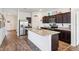 Bright kitchen featuring stainless steel appliances and a large island with granite countertops at 785 Orchid Grove Blvd, Davenport, FL 33837