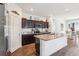 Well-lit kitchen featuring a central island with granite countertops at 785 Orchid Grove Blvd, Davenport, FL 33837