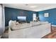 Spacious living room showcasing a comfortable sofa, wood-style floors, and a serene ambiance at 785 Orchid Grove Blvd, Davenport, FL 33837