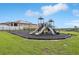 A well-maintained community playground with slides and swings at 785 Orchid Grove Blvd, Davenport, FL 33837