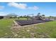 The community playground features swings, a slide, and sunshades at 785 Orchid Grove Blvd, Davenport, FL 33837