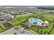 Aerial view of the community pool, playground, and parking at 785 Orchid Grove Blvd, Davenport, FL 33837