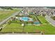 Beautiful aerial view of the community pool, playground, and amenities at 785 Orchid Grove Blvd, Davenport, FL 33837